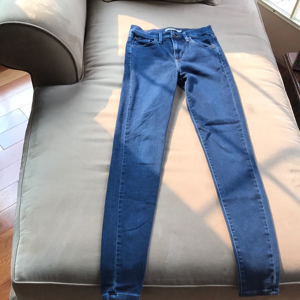 720 high rise super skinny blue jeans